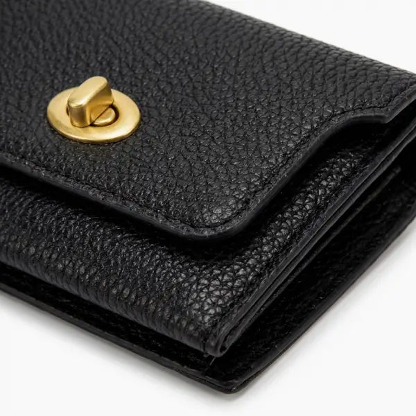 Black leather wallet with a gold clasp on a white background