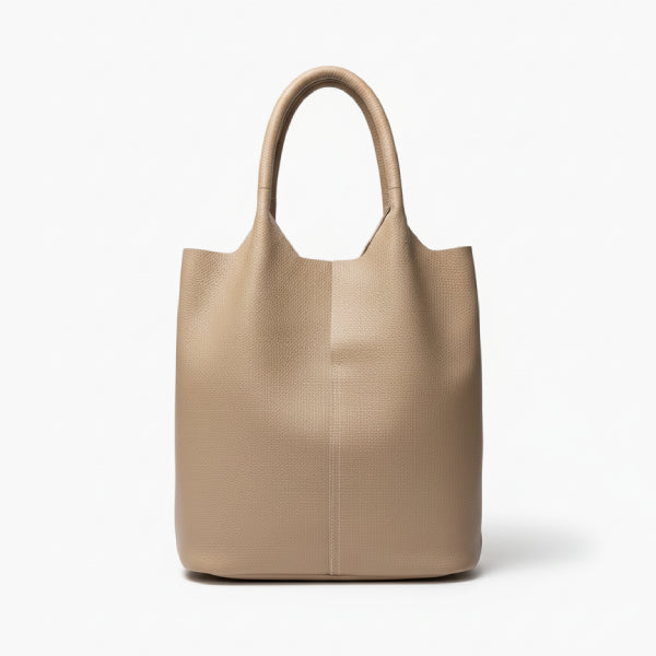 Front view of khaki cowhide leather tote bag with minimalist design, featuring a structured shape and durable handles for everyday use