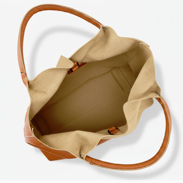 Interior view of caramel cowhide leather tote bag, showcasing the spacious compartment with a smooth lining and sturdy construction