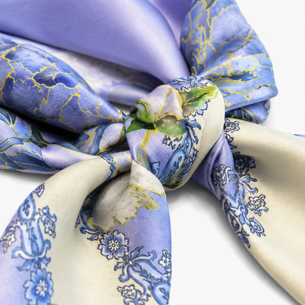 Close-up of a patterned fabric with blue and beige colors on a white background