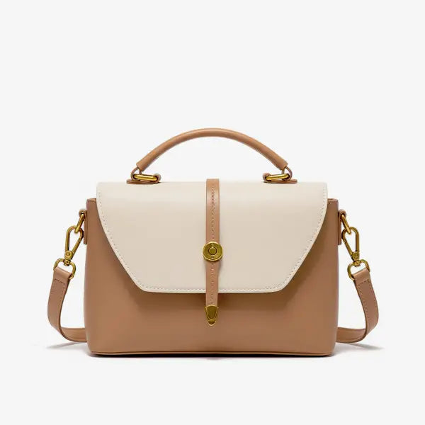 Front view of a beige vegan leather crossbody bag with gold accents and a top handle