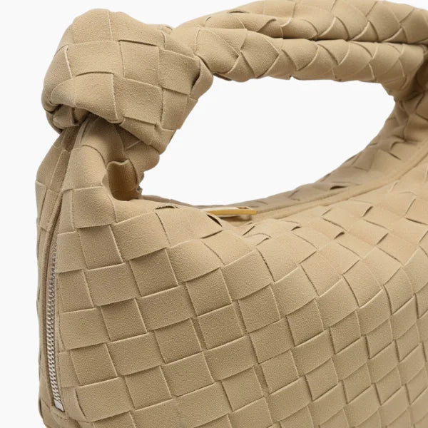 Seraphine Vegan Leather Hobo Bag in apricot, close-up of matte woven texture with knotted handle and gold zipper
