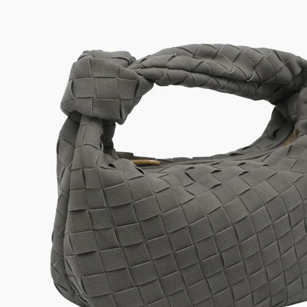 Seraphine Vegan Leather Hobo Bag in gray, close-up of matte woven texture with knotted handle and gold zipper