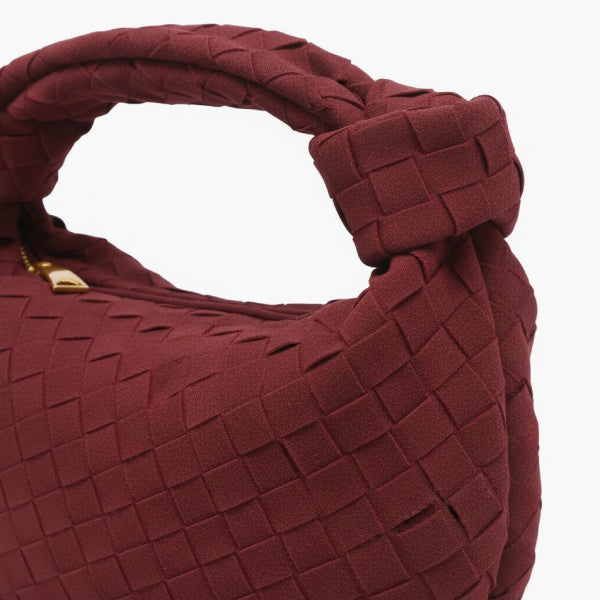 Seraphine Vegan Leather Hobo Bag in wine red, close-up of matte woven texture with knotted top handle and gold zipper