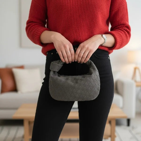 Seraphine Vegan Leather Hobo Bag in gray, lifestyle shot with model holding the mini woven hobo for casual everyday style