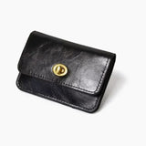 Signature Vegan Leather Wallet in black, front view with a gold-tone turn-lock clasp