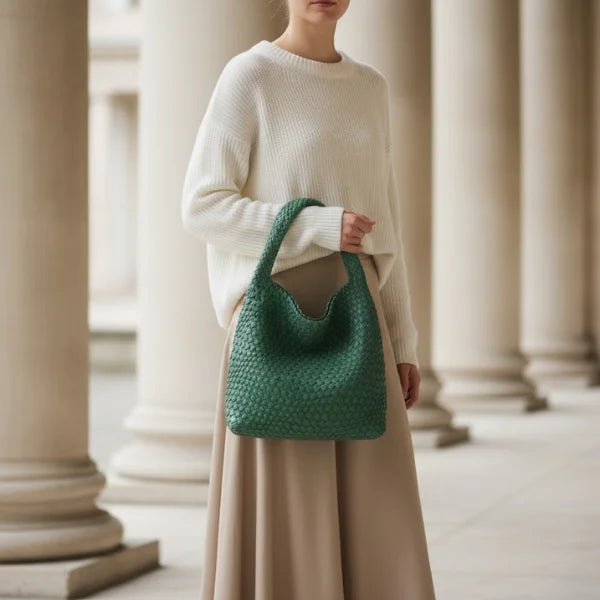 Soraya Vegan Leather Hobo Bag in green, lifestyle image with model highlighting large woven hobo for chic everyday style