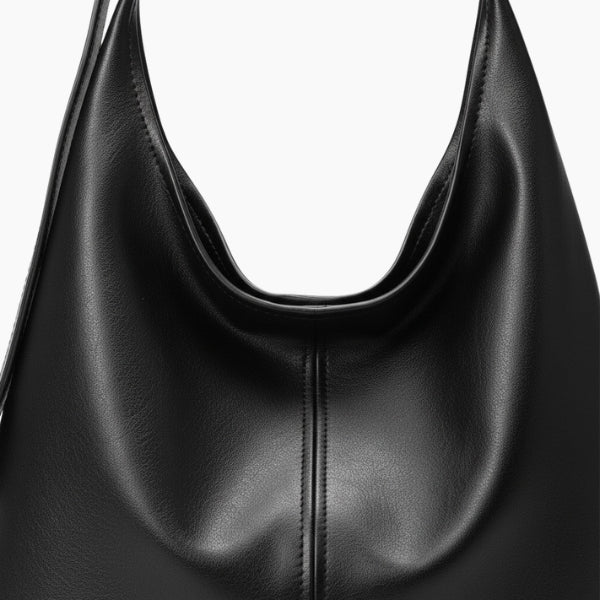 Sorella Vegan Leather Hobo Bag in black, close-up of smooth vegan leather and softly draped silhouette