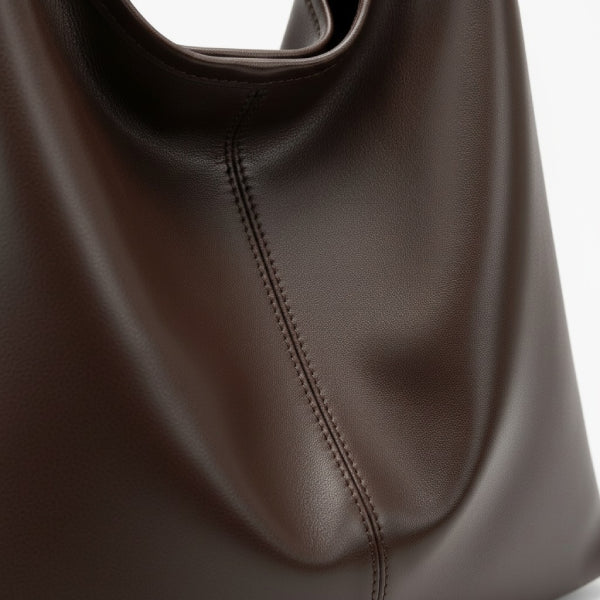 Sorella Vegan Leather Hobo Bag in coffee, close-up of smooth vegan leather with soft drape and center seam