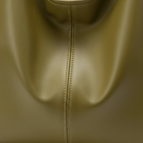 Sorella Vegan Leather Hobo Bag in green, close-up of smooth vegan leather with soft drape and center seam