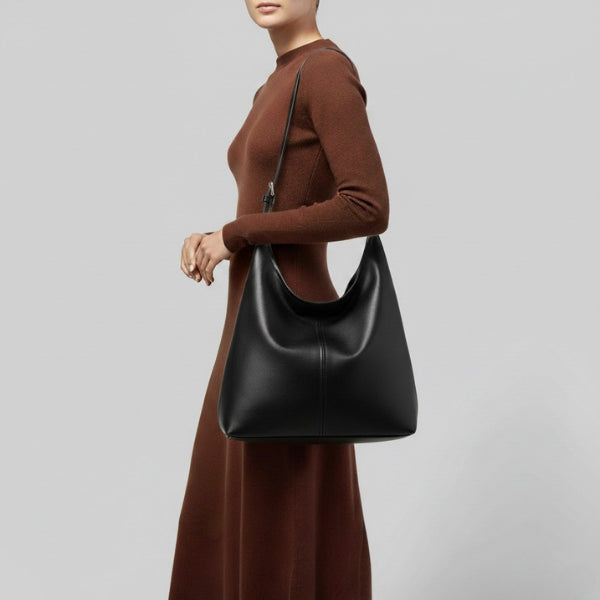 Sorella Vegan Leather Hobo Bag in black, lifestyle image with model wearing the shoulder hobo for modern everyday style