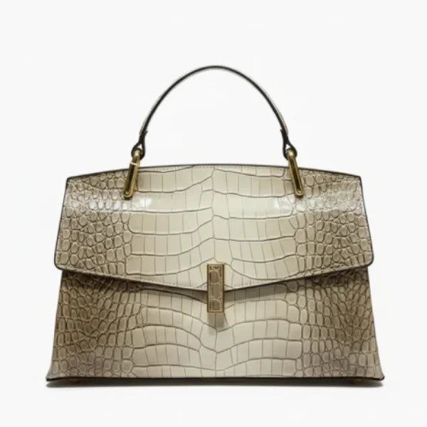 Front view of gray crocodile leather satchel bag featuring a gold clasp and glossy textured finish