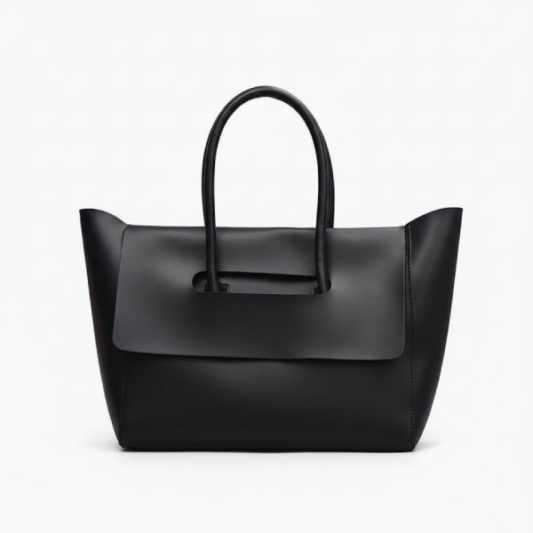 Front view of black vegan leather tote bag with structured design and elegant flap closure for a sophisticated look