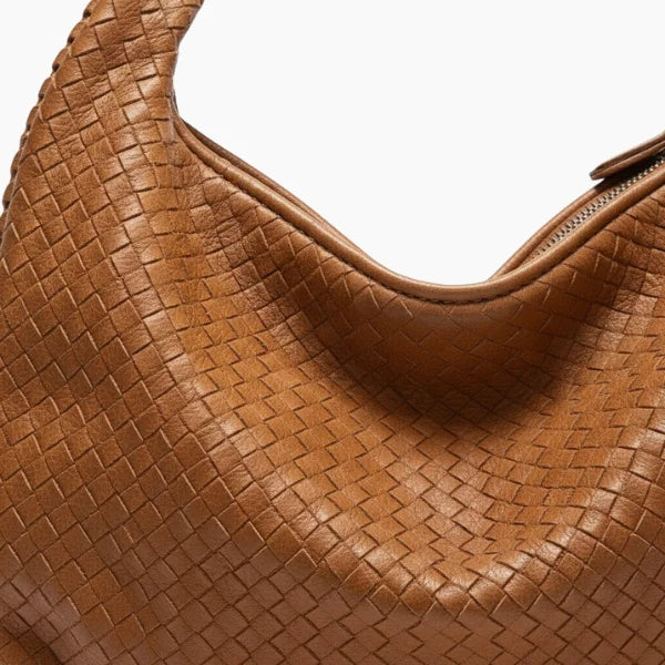 Valencia Vegan Leather Hobo Bag in brown, close-up of braided handle and woven grain with metal zipper detail