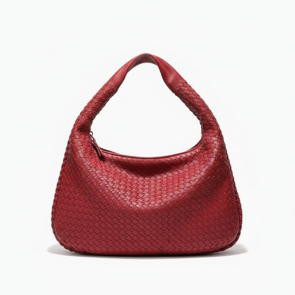 Front view of red woven vegan leather hobo bag with wide handle, zipper opening, and smooth texture