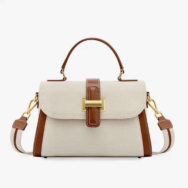 Front view of the off-white genuine leather satchel bag with brown leather accents and a gold-tone clasp, offering a stylish and sophisticated design