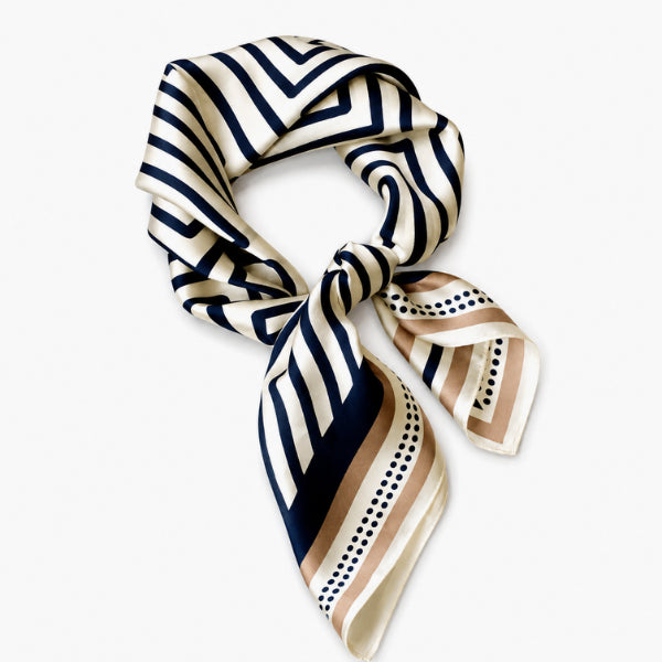 Navy and beige striped scarf on a white background