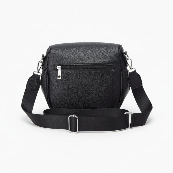 Back view of a black vegan leather crossbody bag with zipper pocket, adjustable strap, and silver hardware