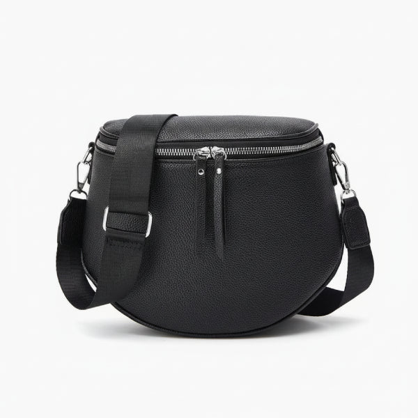 Front view of a black vegan leather crossbody bag with round shape, double zipper closure, and adjustable strap