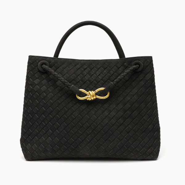 Front view of the Veyra vegan leather tote bag in black, featuring a woven texture and gold-tone knot closure for a sophisticated touch