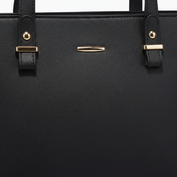 Close-up of the Vivienne vegan leather tote bag in black, showcasing its sleek design with gold-tone accents and sturdy straps