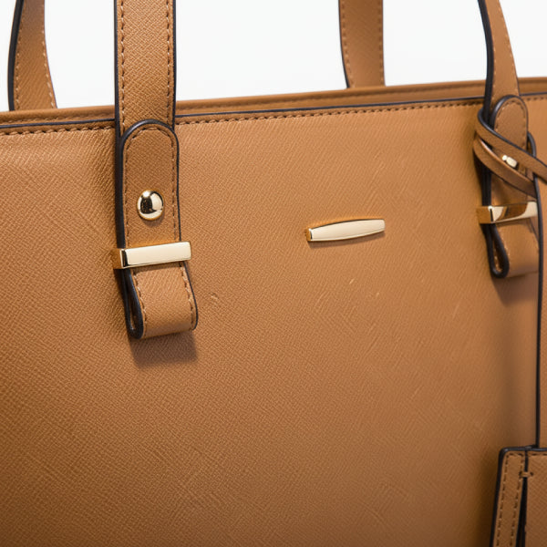 Close-up of the Vivienne vegan leather tote bag in brown, showcasing the elegant design with gold-tone accents and sturdy straps