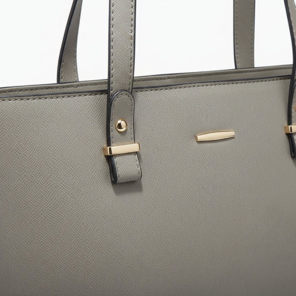 Close-up of the Vivienne vegan leather tote bag in gray, highlighting the elegant design with gold-tone accents and sturdy straps
