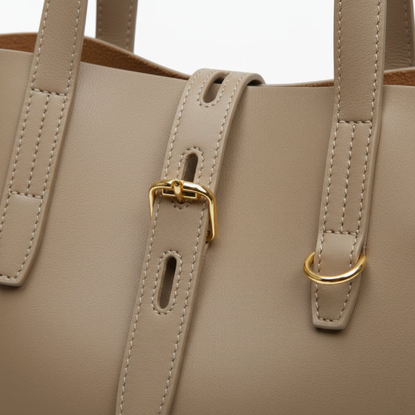 Close-up of the Zairen genuine cowhide tote bag in khaki, showcasing the leather texture and gold hardware