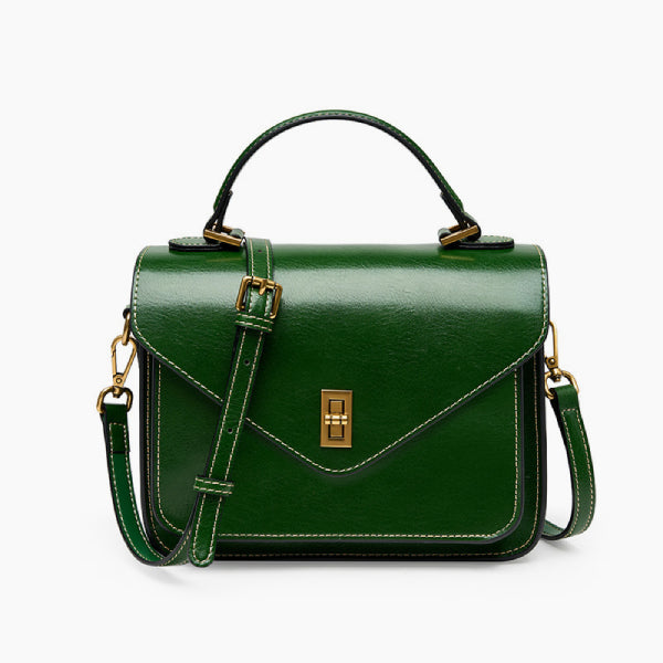 Front view of the green genuine leather satchel bag with gold-tone hardware, offering a structured and elegant design perfect for any occasion